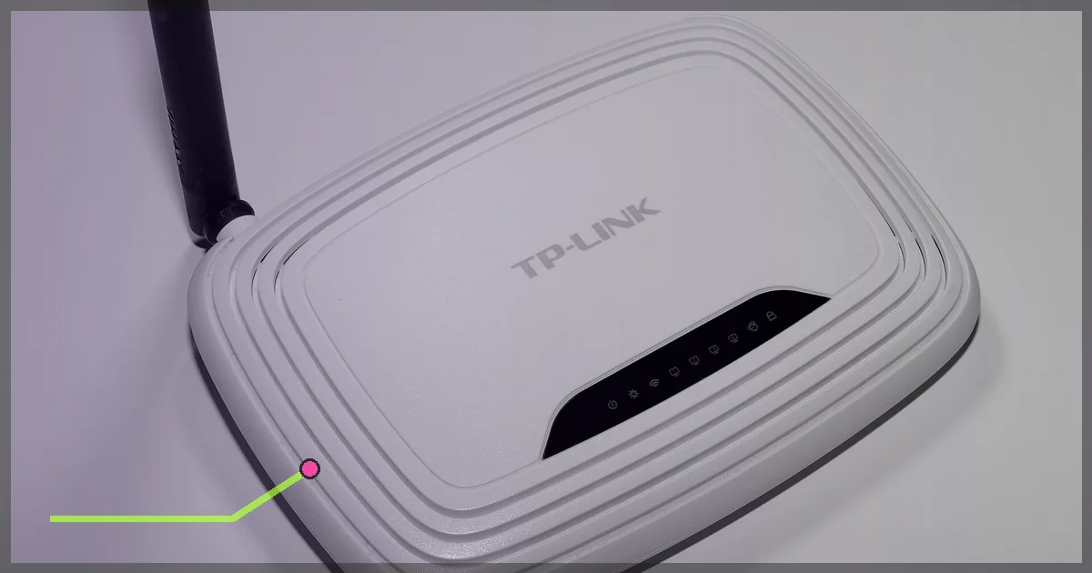 White Wi-Fi router photographed against a neutral background